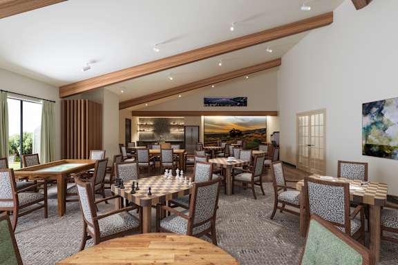 A restaurant with wooden chairs and tables.