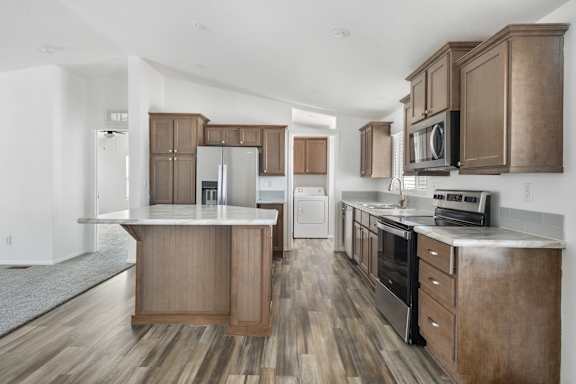A kitchen with wooden cabinets and a white countertop.
