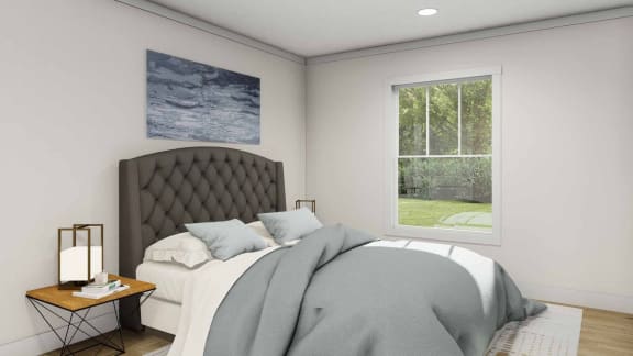 a bedroom with a large bed and a large window