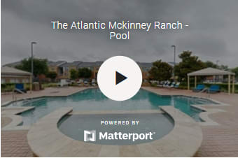 A pool at The Atlantic McKinney Ranch is shown with a play button overlay, indicating a video is available.
