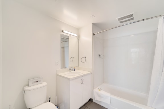 a bathroom with a sink toilet and a shower