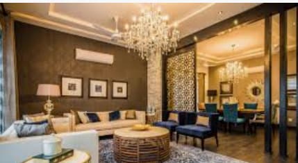 a living room filled with furniture and a chandelier