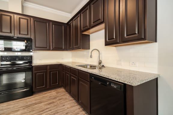 Open Concept Kitchen with Appliances and Granite Countertops