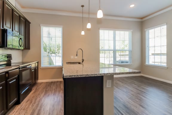 Island Kitchen with Appliances and Granite Countertops