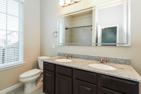Bathroom with Granite Countertops and Double Vanity