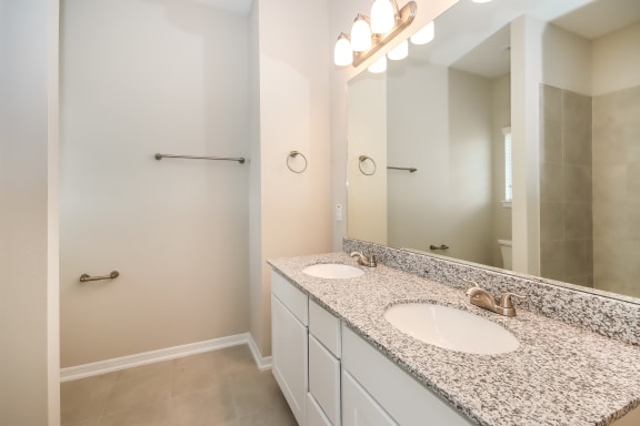 Designer Granite Countertops In All Bathrooms at Lakeside Conroe, Texas
