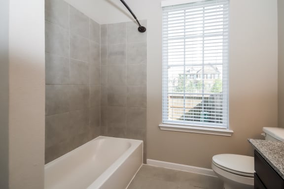 Bathroom with Granite Countertops and Double Vanity