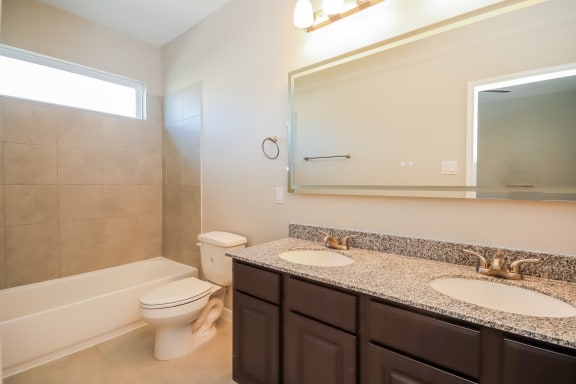 Bathroom with Granite Countertops and Double Vanity