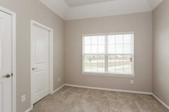 Bedroom With Expansive Windows at Clearwater at Balmoral, Atascocita, Texas