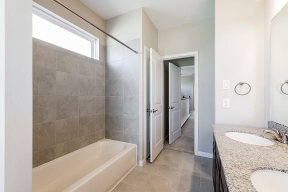 Bathroom with Granite Countertops and Double Vanity