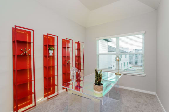 a room with four red doors and a window