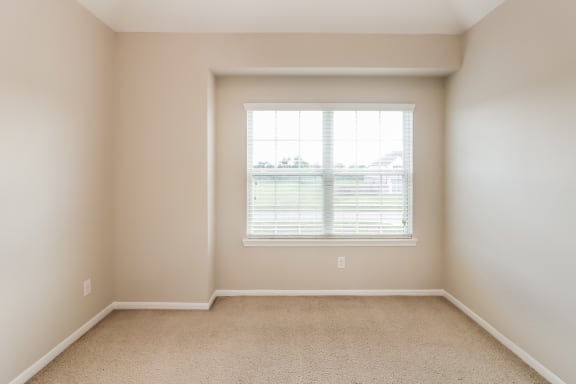 an empty room with a window in it