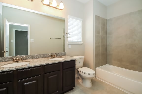 Bathroom with Granite Countertops and Double Vanity