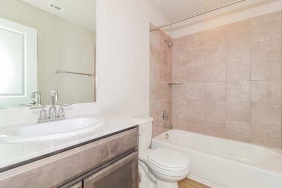 a bathroom with a sink toilet and bathtub