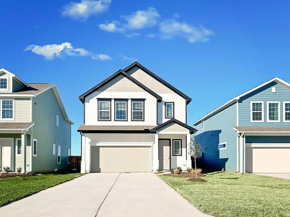 a house in a subdivision with a blue sky in the background