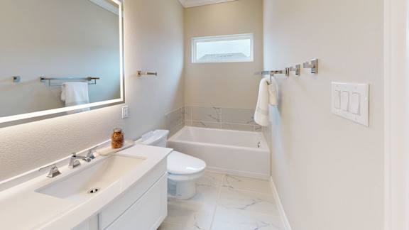 a bathroom with a sink toilet and a bath tub