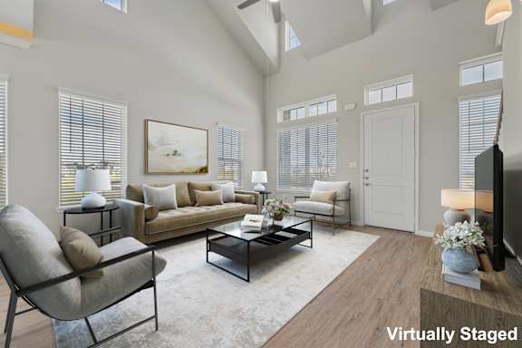 A living room with a couch, chair, and coffee table.