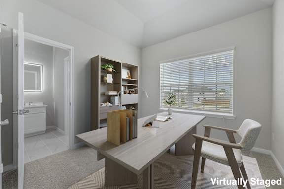 A virtual staging of a room with a desk, chair, and bookshelf.