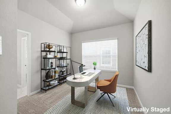 A room with a desk, chair, and shelves.