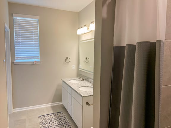Dual Vanity Bathroom with Granite Countertops