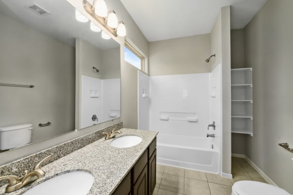 Bathroom with Granite Countertops and Double Vanity