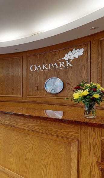 a vase of flowers sitting on top of a wooden counter