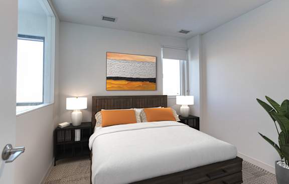 a bedroom with a large bed and a painting on the wall