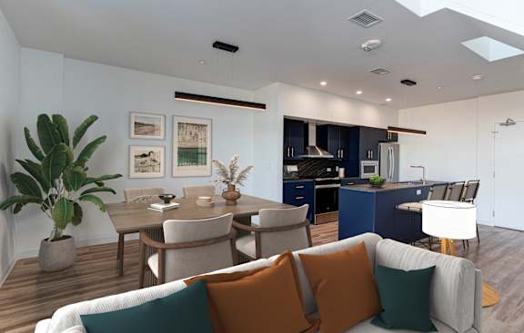 a living room and dining room with a couch and chairs
