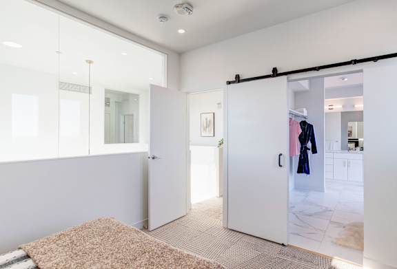 a sliding glass door in a closet in a bedroom