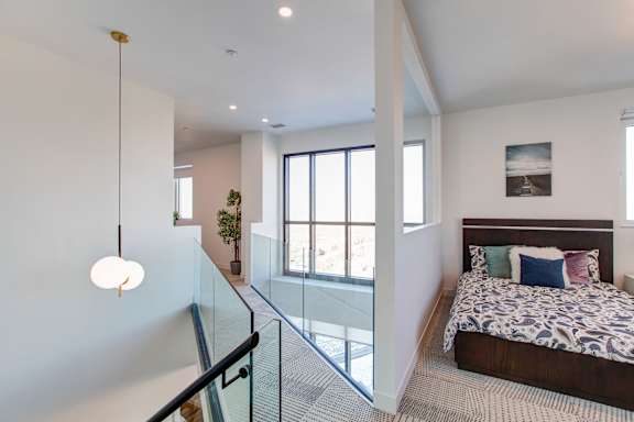 a bedroom with a bed and a glass floor