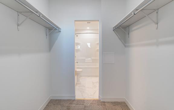 a bathroom with a shower and a glass door