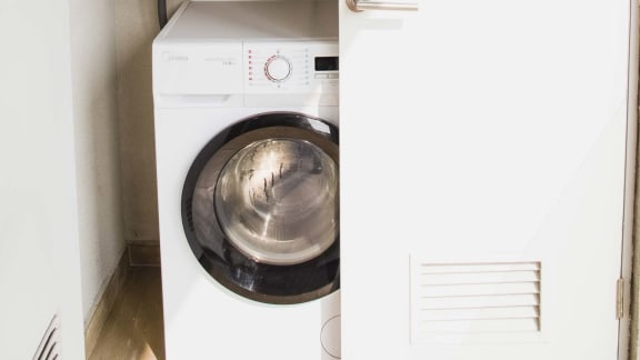 a white washer and dryer in a laundry room