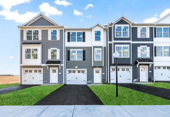exterior grey and sage siding white trim white garage