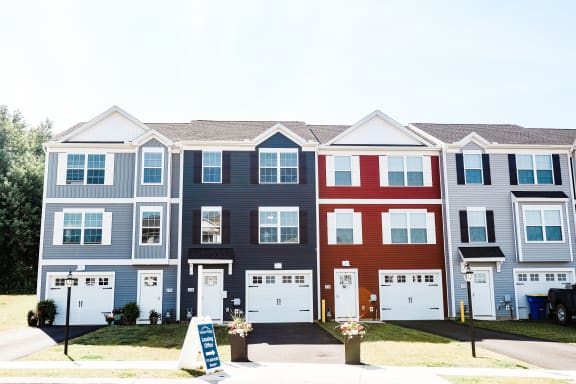 a row of townhomes with a blue sky in the background at Hudson Ridge, Red Lion, Pennsylvania
