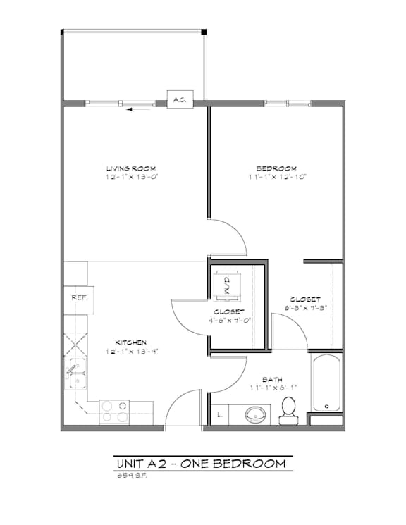 A floor plan of a one bedroom apartment with a living room, bedroom, and kitchen.