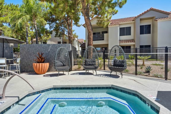 our apartments have a resort style pool and lounge chairs