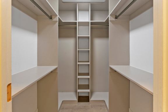 A white ladder in a small room.