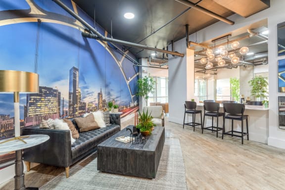 a living room with a large wall mural of a city