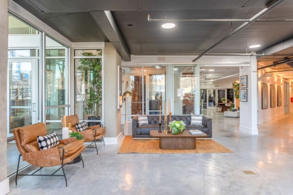 the lobby of a building with couches and a coffee table