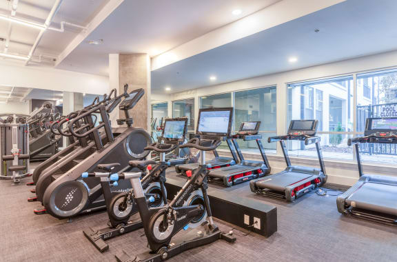 a gym with cardio machines and other exercise equipment