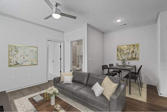 A living room with a grey couch and a coffee table.