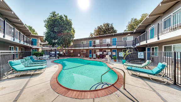 A sunny day at the pool of a residential complex at Pennsylvania Place, Davis, CA