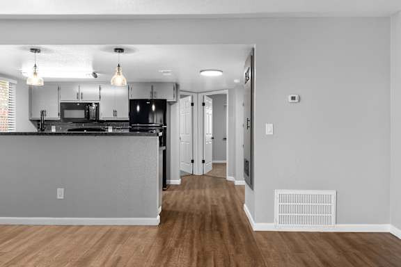 Open floor plan with breakfast bar and modern kitchen at Redwood Cove Apartments, Chico, CA 95928