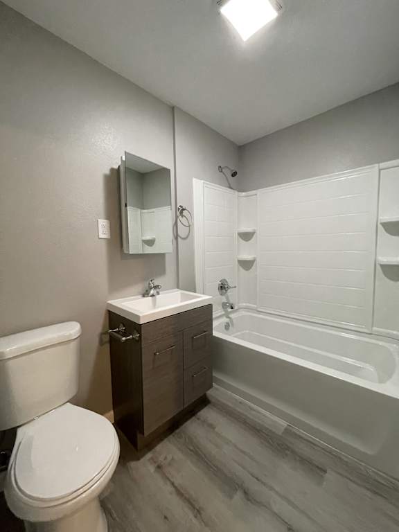 Bathroom with dark wood vanity and white tub surround at OSM Properties Homes & Apartments, Chico