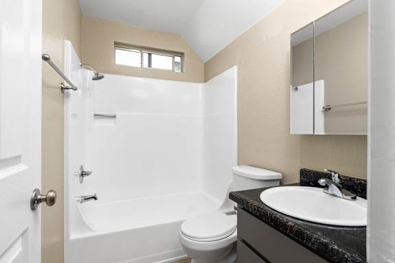 Bathroom with tub shower combo and vanity at Cedar Park Apartments, Chico, CA