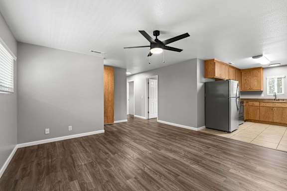 Open concept living area with ceiling fan at OSM Properties Homes & Apartments, Chico, CA