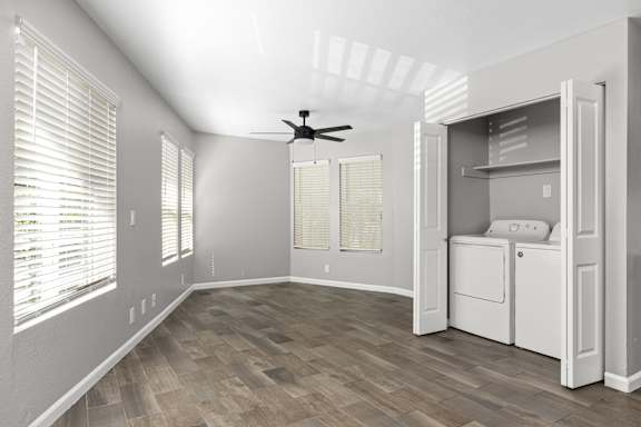 Empty room with laundry closet and ceiling fan at OSM Properties Homes & Apartments, California, 95926