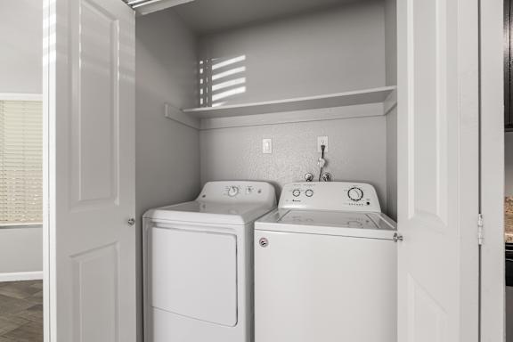 Inunit laundry closet with washer and dryer at OSM Properties Homes & Apartments, Chico