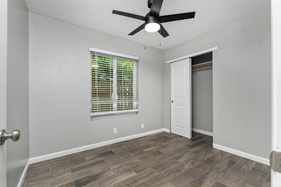 Empty bedroom with wood style flooring and ceiling fan at OSM Properties Homes & Apartments, Chico, California