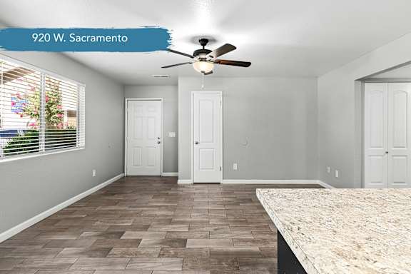 Spacious living room with granite kitchen counter at OSM Properties Homes & Apartments, Chico